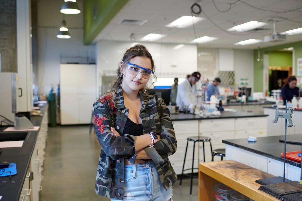 Student standing in a laboratory.